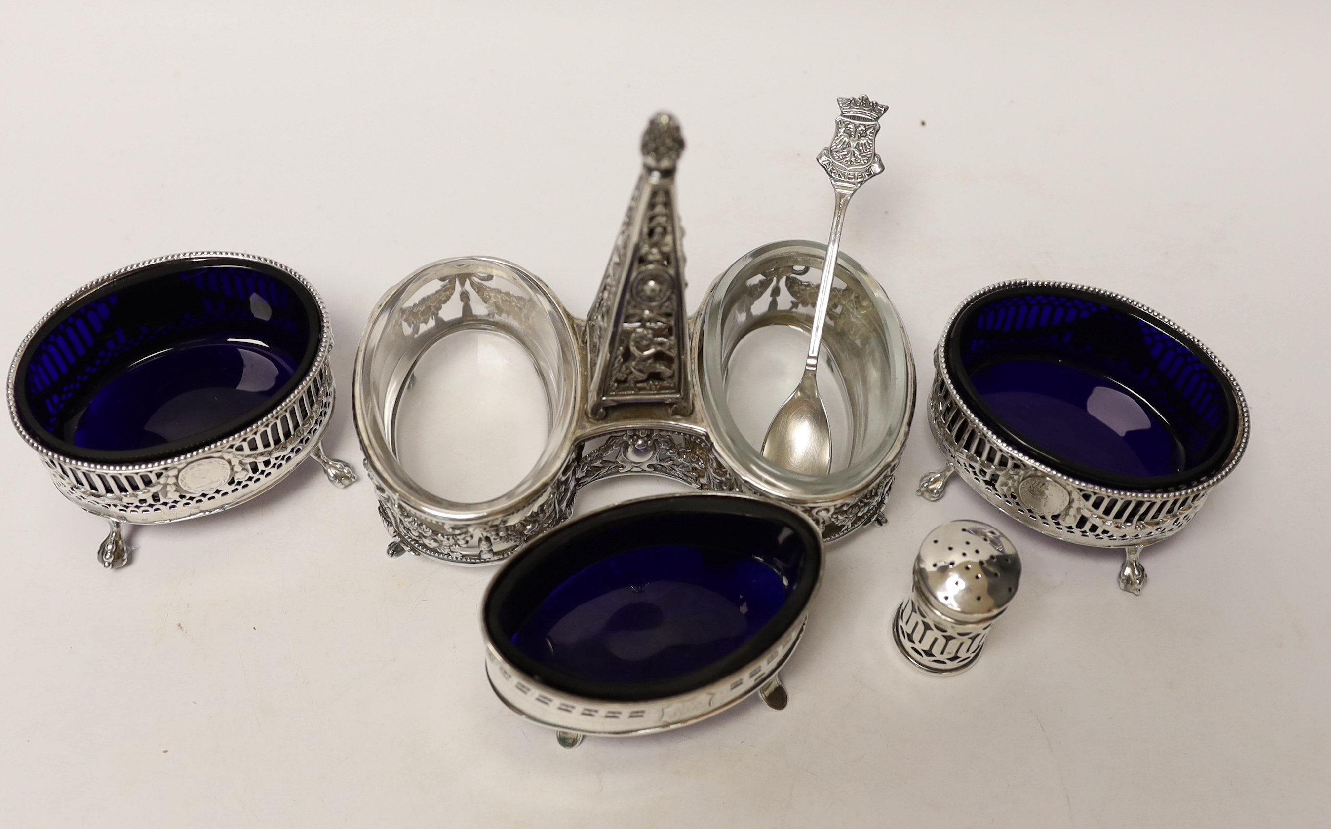 A French pierced white metal double condiment stand, height 14.6cm and four other silver condiments including pair of George III silver salts by Daniel Holy & Co.